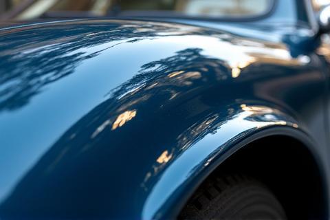 Close up showing a sharp reflection on car paint